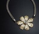 “Rising Rose” by Sherry Chaples – bronze & silver pendant