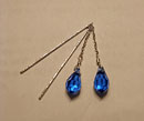 “Blue Topaz Threader Earrings” by Tyler Kulenguski